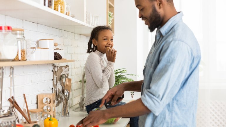 Father and daughter cooking together