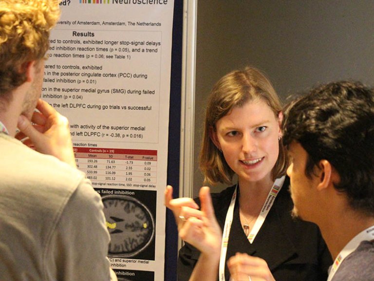 Students looking at each others work at the poster market