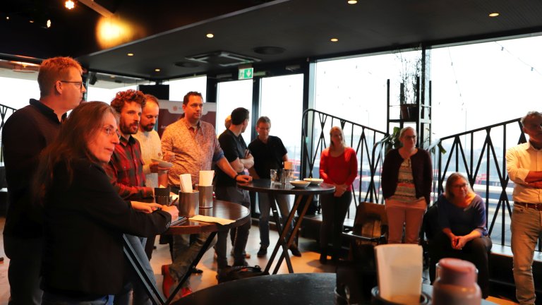 Figure 3: After the participants pitched their research and had soaked up all the knowledge, the chairs were pushed to the side and discussions could commence.