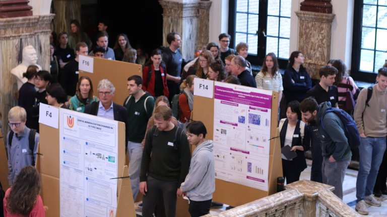 PhD candidates in disucssion during the poster session